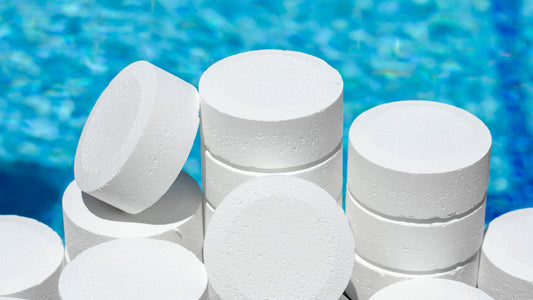 Chlorine tablet for swimming pools. Chemical products for the maintenance of swimming pools in the form of round tablets to keep the water and ph clean by adding chlorine to the swimming pools